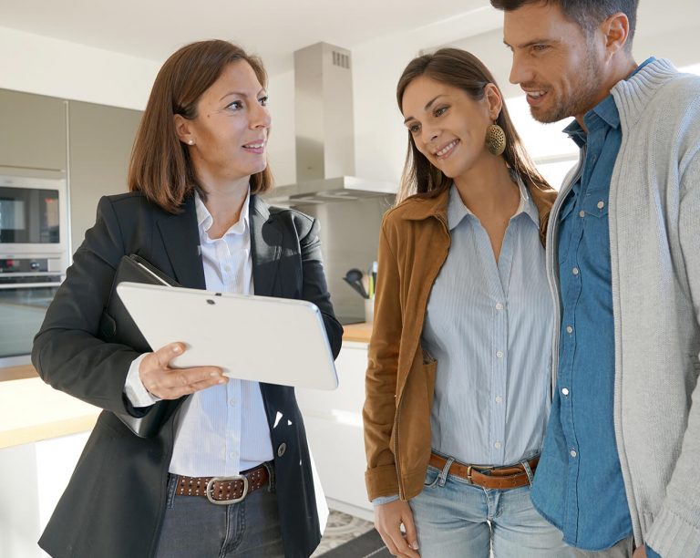 Real estate agent going over an offer with her clients