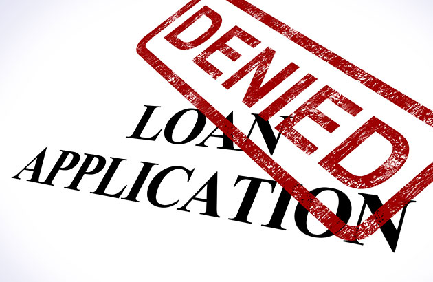 Loan application with denied stamped on top